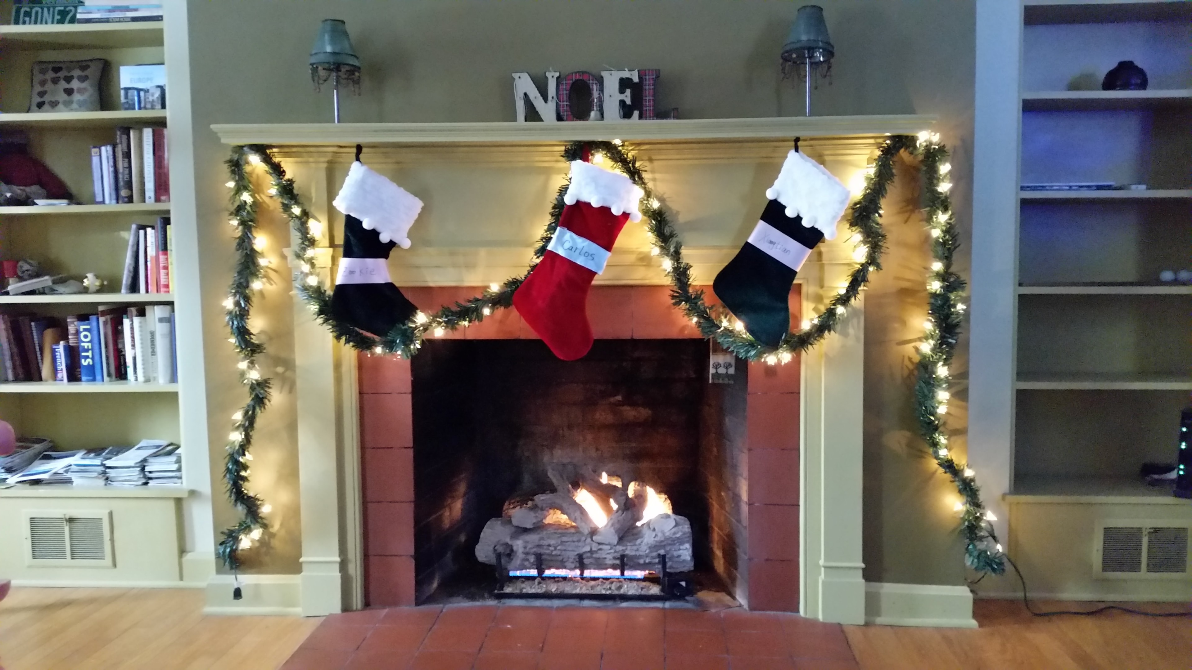Vermont fireplace decorated with Christmas stockings and garland