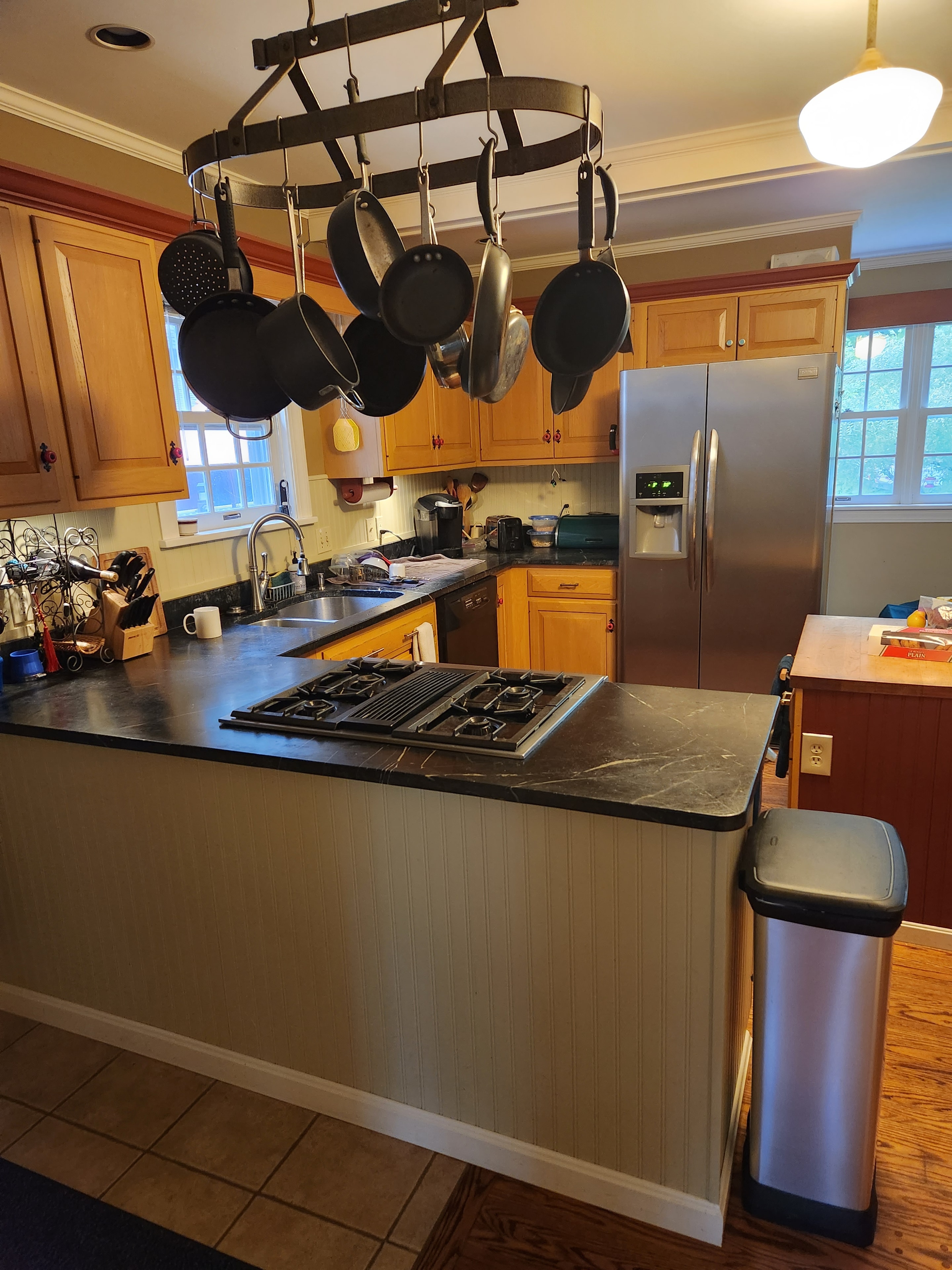 Vermont kitchen with wood cabinetry, appliances, and central island